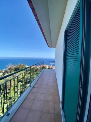 a balcony with a view of the ocean at Oceanview Getaway in Caniço