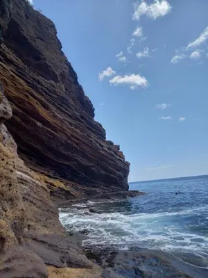 a view of the ocean from a rocky beach at Enjoy Madeira 1 in Caniço