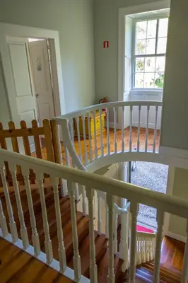 a white staircase in a house with a window at Quinta das Malvas - Quinta de Santa Luzia in Funchal