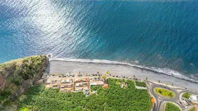 an aerial view of a resort on the beach at Ferreira's Retreat in Ponta do Sol