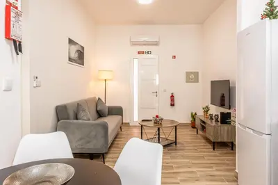 a living room with a couch and a table at Ferreira's Retreat in Ponta do Sol
