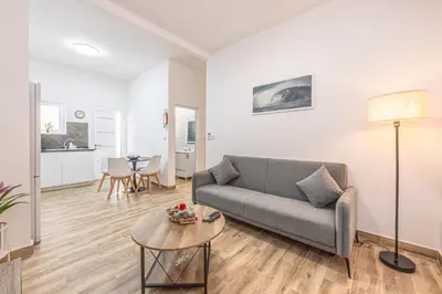 a living room with a couch and a table at Ferreira's Retreat in Ponta do Sol