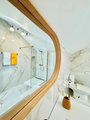 a bathroom with a shower and a sink at Refúgio do Vale Verde in Ponta do Sol
