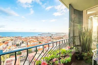 a balcony with a view of a city at Apartamento Eden in Funchal