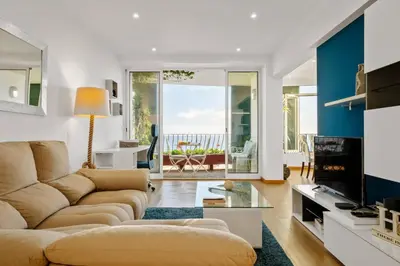 a living room with a couch and a table at Apartamento Eden in Funchal