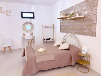 a bedroom with a bed in a white room at ALc in Ribeira Brava