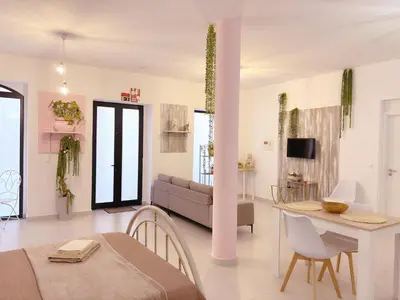 a living room with a couch and a table at ALc in Ribeira Brava