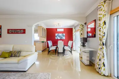 a living room with a white couch and a table at The White House in Lagos