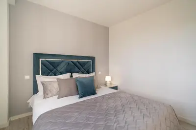 a bedroom with a large bed with pillows at Lux House - free park- WiFi - Sea View in Funchal