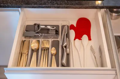 a drawer with spoon and forks and spoons at Lux House - free park- WiFi - Sea View in Funchal