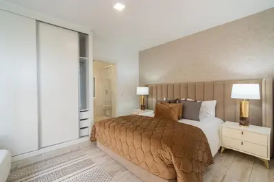 a bedroom with a large bed and a large window at Lux House - free park- WiFi - Sea View in Funchal