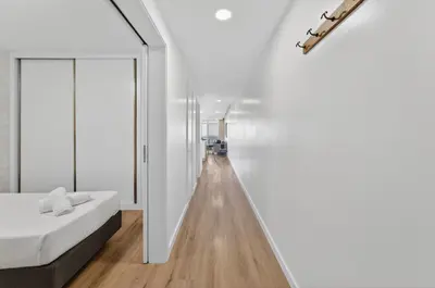 a bedroom with a large white bed with two night stands at Sunset Atlantic Gardens Apartments 408 in Funchal