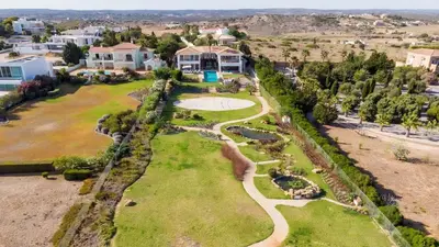 an aerial view of a house with a garden at Luxury Villa by the Sea with Ocean Views in Luz