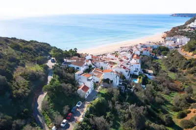 an aerial view of a village on the beach at Chalet du Solei- V022 in Salema