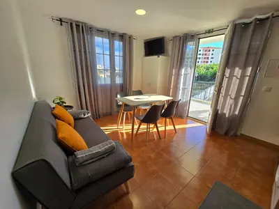 a living room with a couch and a table at Autonomia House I in Câmara de Lobos