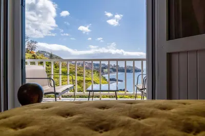 a view of a balcony with a view of the water at Villa Irene in Funchal
