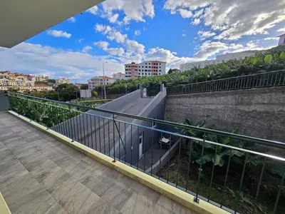 a balcony with a view of a city at Autonomia House II in Câmara de Lobos