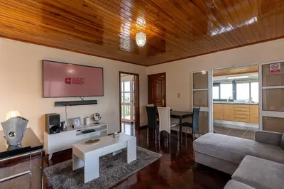 a living room with a couch and a table at GuestReady - Restful Getaway in Madeira in Estreito da Calheta