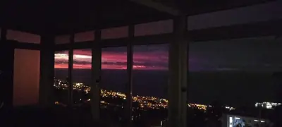 a view of a city skyline from a window at Carros De Cesto Do Monte in Funchal