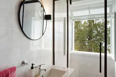 a bathroom with a sink and a mirror at Carros De Cesto Do Monte in Funchal