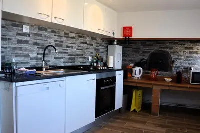 a kitchen with a sink and a stove top oven at Casa Tio Albino I, By OP in Ponta Delgada