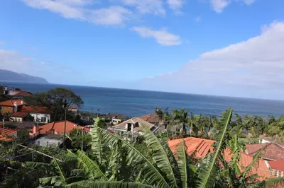 a view of a town with the ocean in the background at Casa do Tio Albino II, By OP in Ponta Delgada
