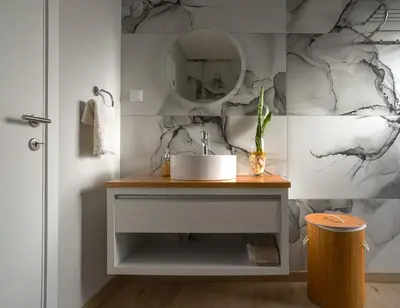 a bathroom with a sink and a mirror at Moonfall House in Arco da Calheta