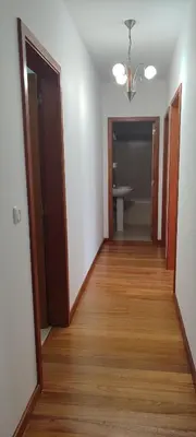 a hallway with two doors and a wood floor at Marina Kings View in Funchal