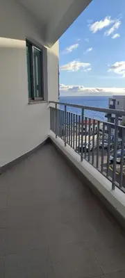a balcony of a house with a view of the ocean at Marina Kings View in Funchal