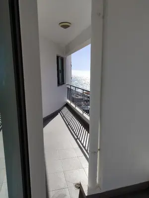 a hallway with a view of the ocean from a building at Marina Kings View in Funchal
