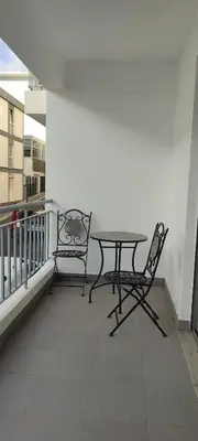 two chairs and a table on a balcony at Marina Kings View in Funchal