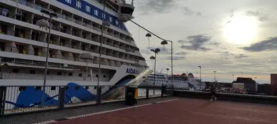 a cruise ship is docked next to a pier at Marina Kings View in Funchal