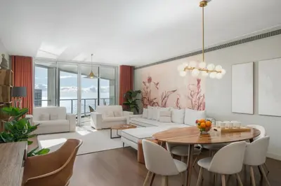 a living room with white furniture and a table at OurMadeira - Palace Ocean View in Funchal