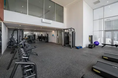 a gym with treadmills and cardio equipment in a building at OurMadeira - Palace Ocean View in Funchal