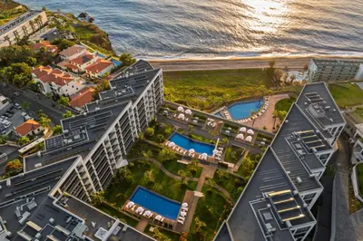 an aerial view of a resort near the ocean at OurMadeira - Palace Ocean View in Funchal