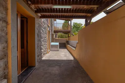 an empty hallway of a house with a wooden ceiling at Casa Levada dos Prazeres by Stay in Prazeres