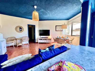 a living room with a blue ceiling at Lagos Ocean Breeze 2 by Homing in Lagos