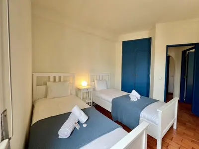 a room with two beds with towels on them at Lagos Ocean Breeze 2 by Homing in Lagos