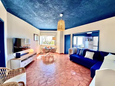 a living room with a blue ceiling at Lagos Ocean Breeze 2 by Homing in Lagos