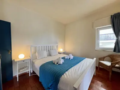 a bedroom with a bed with two towels on it at Lagos Ocean Breeze 2 by Homing in Lagos