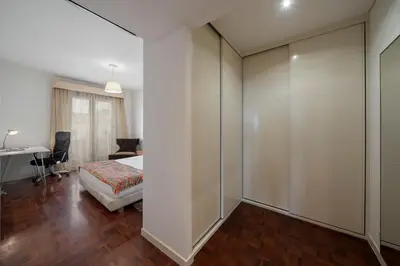 a living room with a couch and a tv at Casa Sta Clara by An Island Apart in Funchal