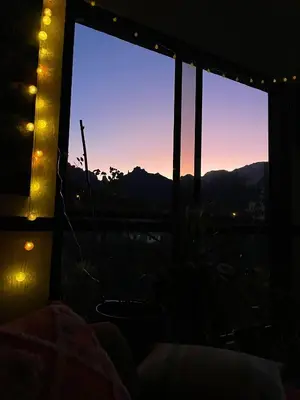 a view from a room with a window with lights at Quinta Vista para o Pico in Faial
