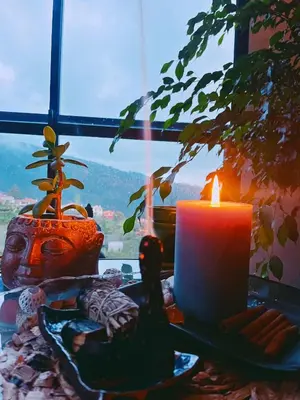 a candle sitting on a table next to a window at Quinta Vista para o Pico in Faial