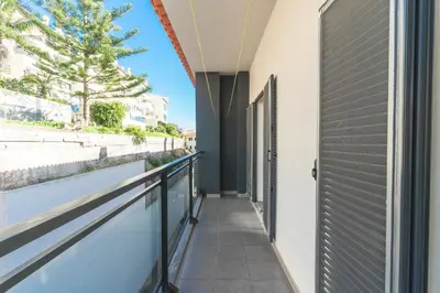 a hallway of a building with a balcony at Quintas Village AY by Atlantic Holiday in Caniço