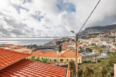 a view of the city of positano and the ocean at Seaside Charm II in Câmara de Lobos