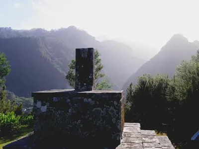 a mountain view of a valley with houses and trees at Green Valley Cruzinhas House with Fireplace & BBQ in Santana