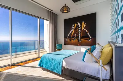 a bedroom with a bed and a large window at Villa Carlota by Holiday Rental Madeira in Caniço