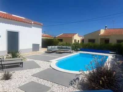 a swimming pool in the middle of a yard at Modern house with private Pool in Sagres