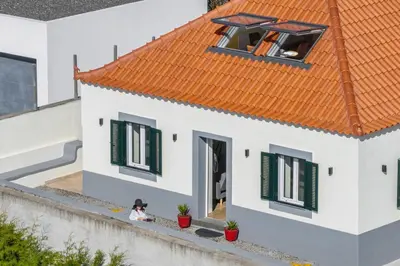 a model of a house with an orange roof at Madeira Friendly Guest House by An Island Apart in Funchal