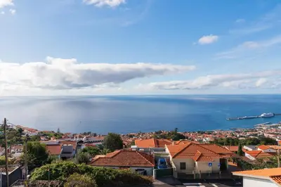 a view of the ocean from a city at Madeira Friendly Guest House by An Island Apart in Funchal